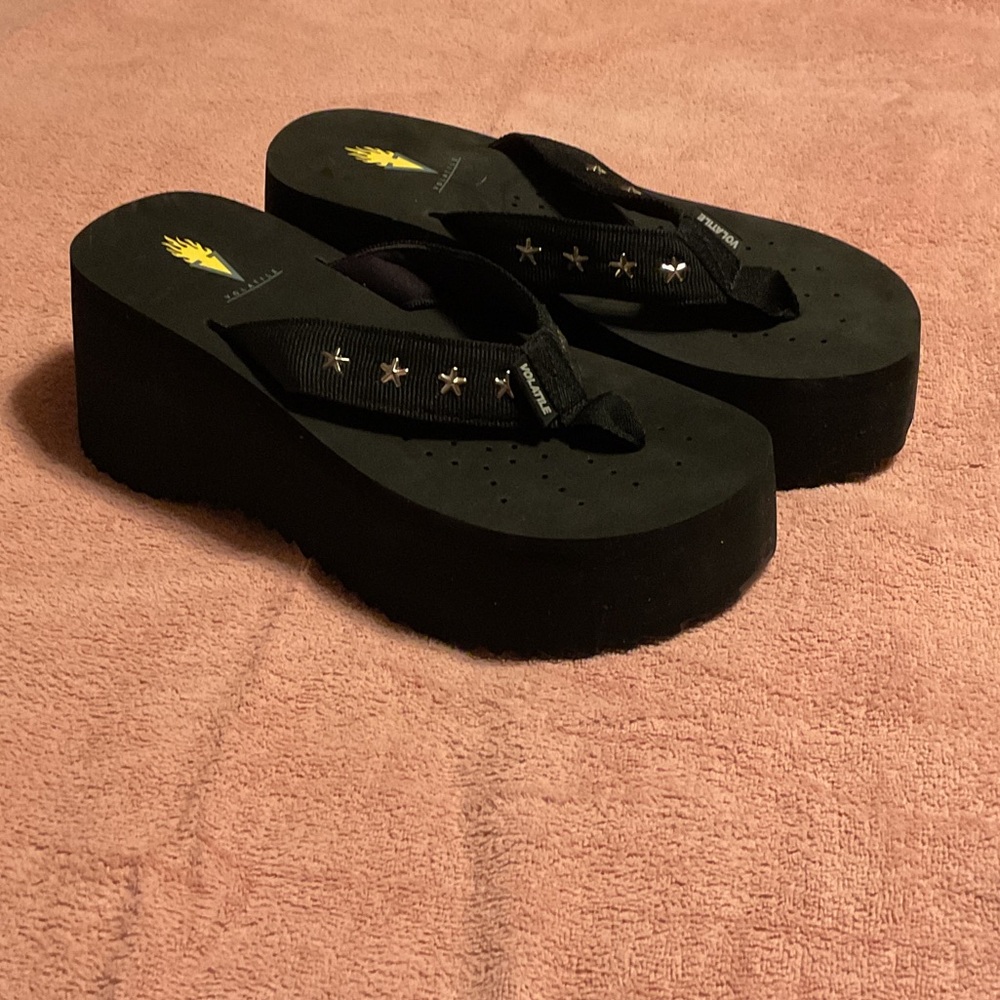 Volatile Black Platform Sandals with Star Accents